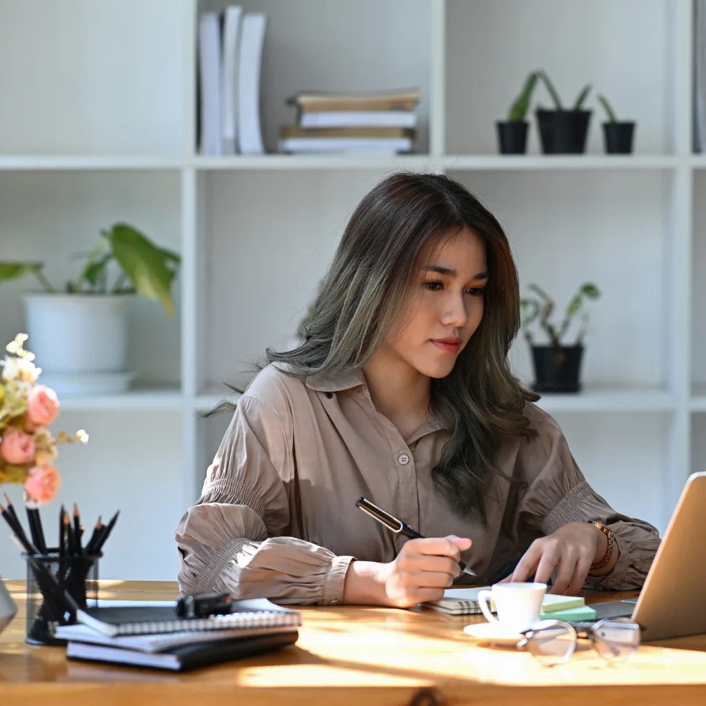 Agent working through property numbers at a desk