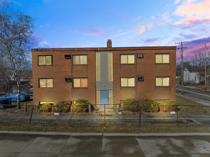Brick apartment building assessed as a rental investment in Northeast Ohio